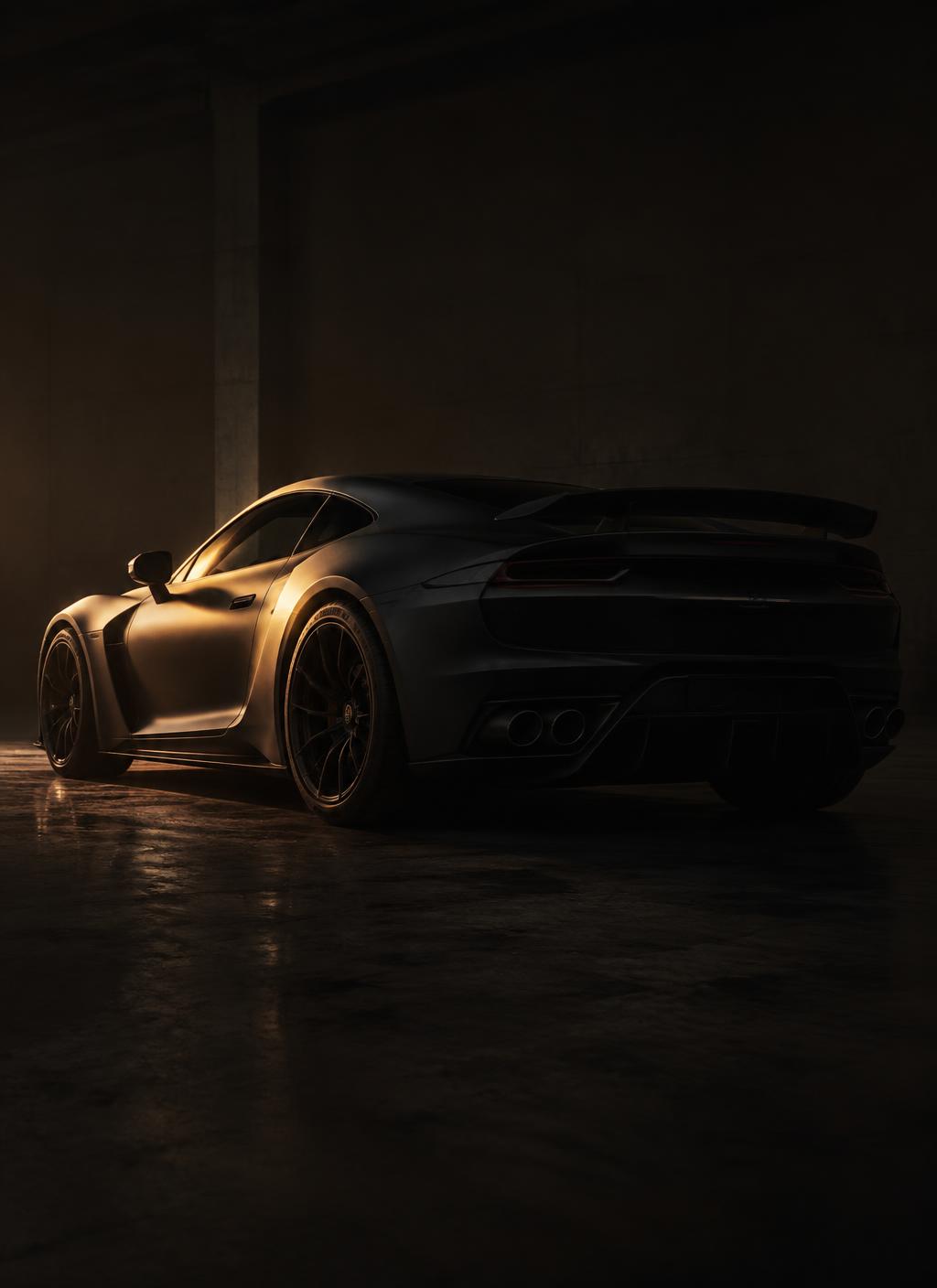 Matte graphite supercar in a dark garage